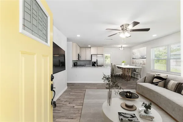 a living room with furniture and a flat screen tv