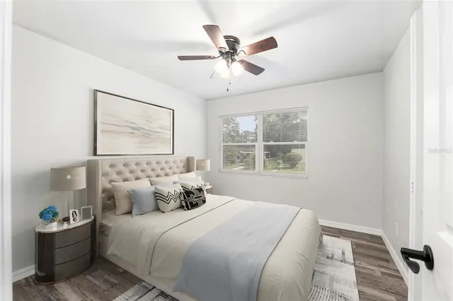 a bedroom with a bed and window