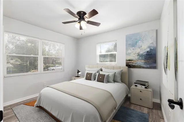 a bedroom with a large bed and a window