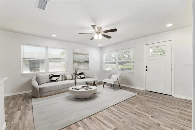 a living room with furniture and a large window