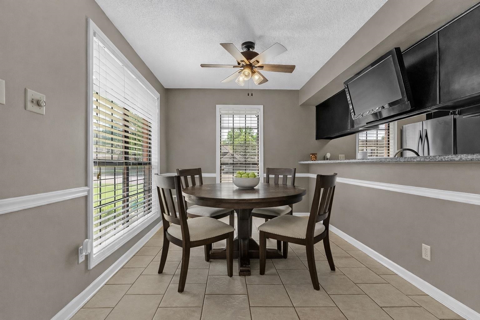 6512 Birch Mill Road Bartlett, TN 38135 - Photo 11 of 25 Dining space with ceiling fan, a textured ceiling, and light tile patterned floors