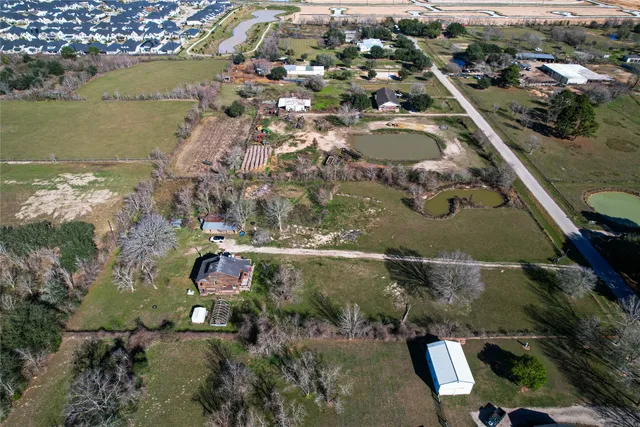 an aerial view of a house swimming pool and outdoor space