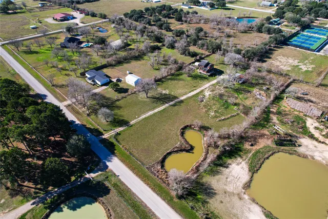 an aerial view of a house with a garden
