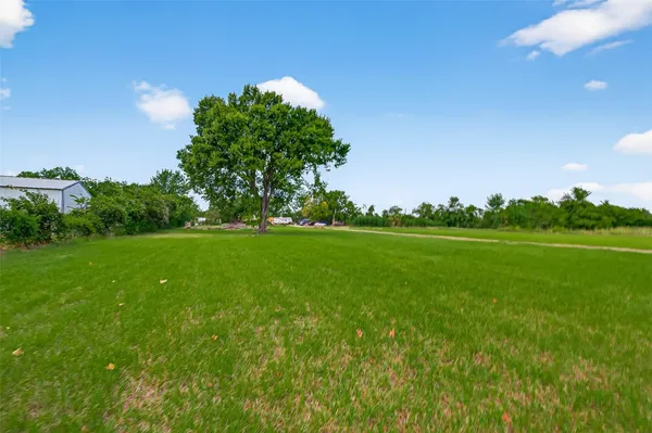 a yard with lots of green space