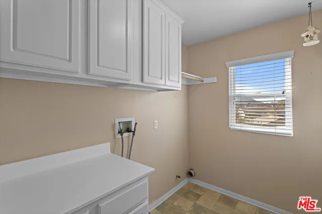 a view of storage and utility room with closet