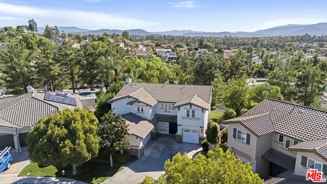an aerial view of a house with outdoor space
