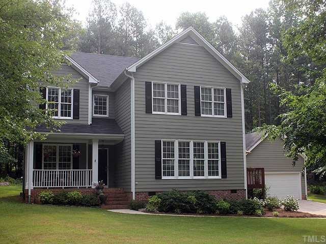 6820 Cool Pond Road Raleigh, NC 27613 - Photo 1 of 12 a front view of a house with garden