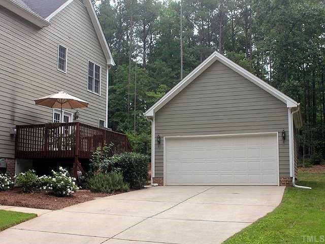 6820 Cool Pond Road Raleigh, NC 27613 - Photo 12 of 12 a front view of a house with a garden