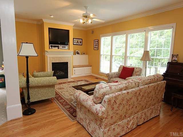 6820 Cool Pond Road Raleigh, NC 27613 - Photo 2 of 12 a bedroom with a bed and a fireplace