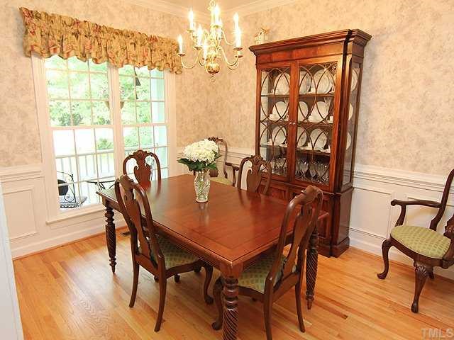 6820 Cool Pond Road Raleigh, NC 27613 - Photo 3 of 12 a view of a dining room with furniture and wooden floor