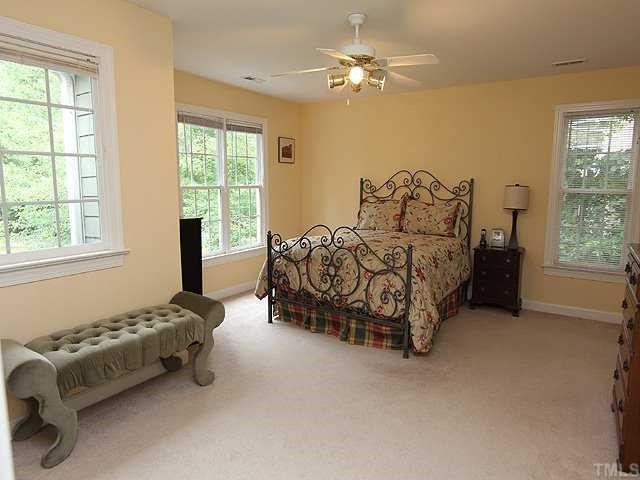 6820 Cool Pond Road Raleigh, NC 27613 - Photo 6 of 12 a bed room with a bed and a window