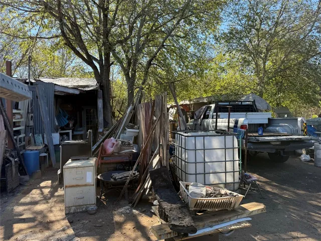 a view of a house with a tree