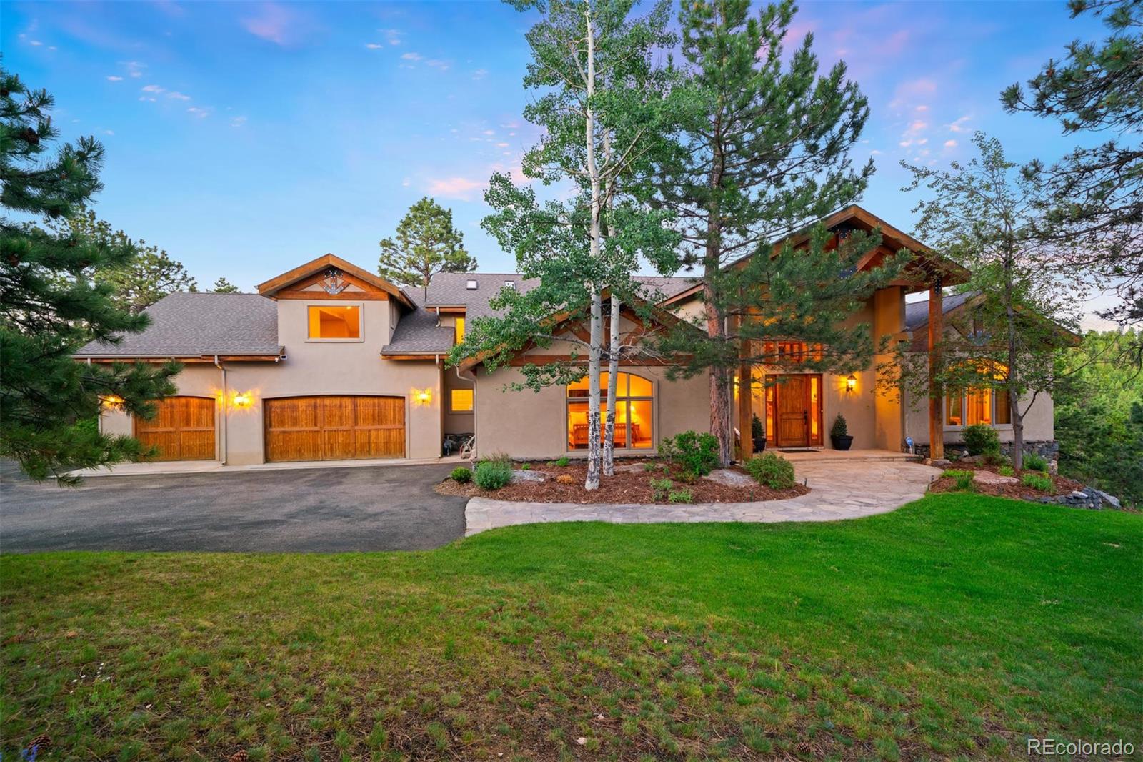 33231 Meadow Mountain Road Evergreen, CO 80439 - Photo 1 of 40 front view of a house with a yard and front view of a house