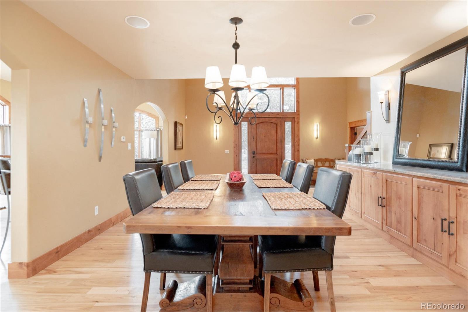 33231 Meadow Mountain Road Evergreen, CO 80439 - Photo 14 of 40 a view of a dining room with furniture window and wooden floor