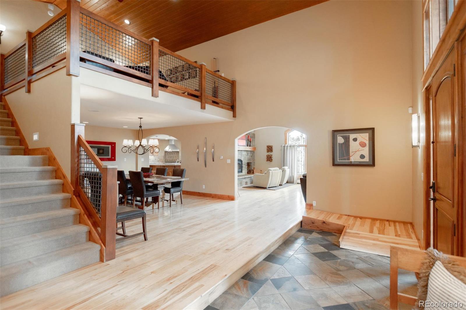33231 Meadow Mountain Road Evergreen, CO 80439 - Photo 15 of 40 a view of a livingroom with furniture and a table