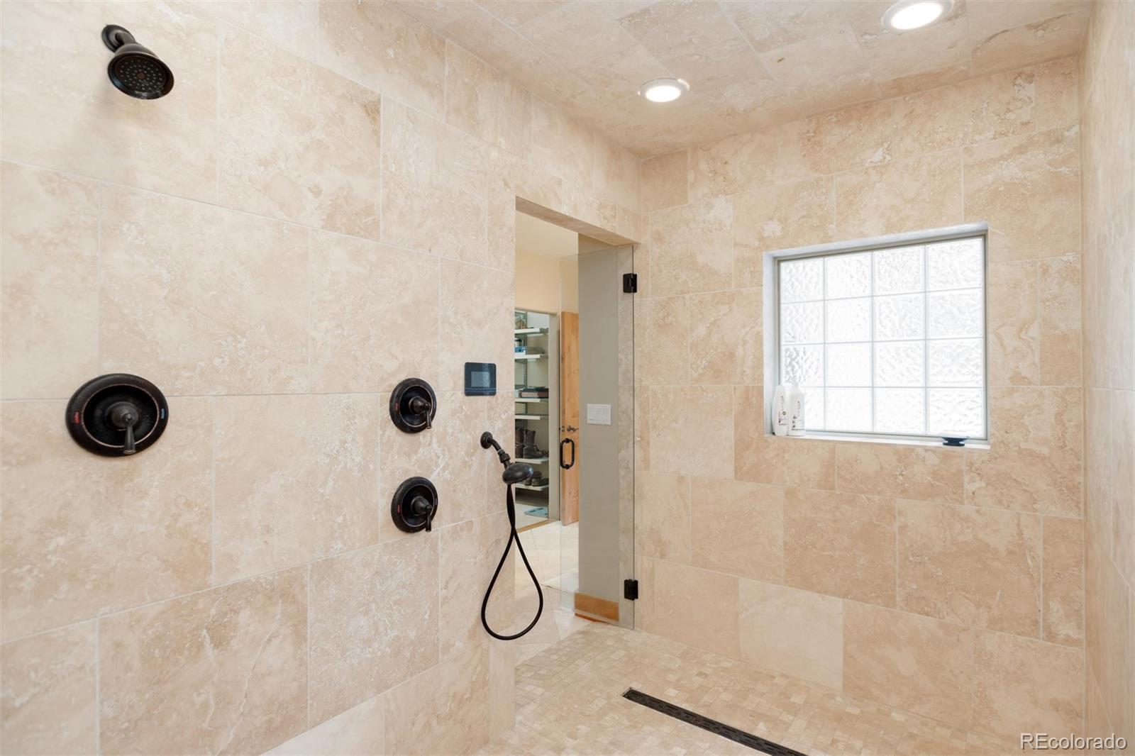 33231 Meadow Mountain Road Evergreen, CO 80439 - Photo 19 of 40 a bathroom with a shower