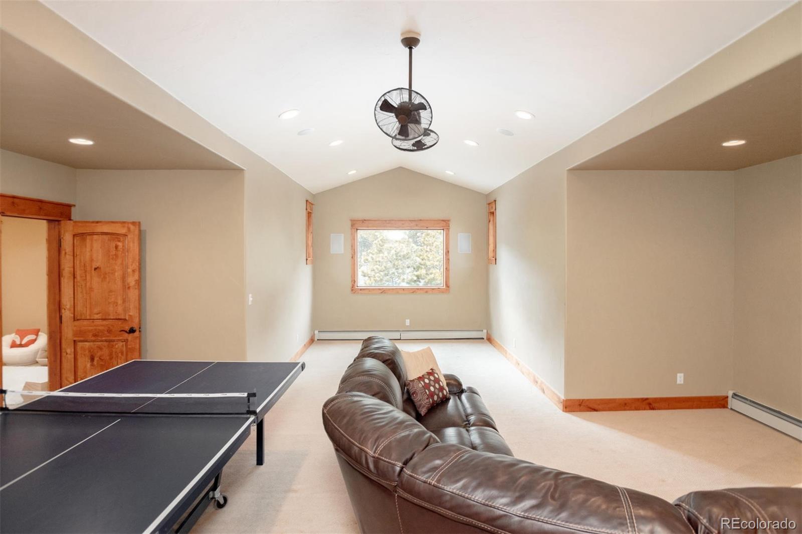 33231 Meadow Mountain Road Evergreen, CO 80439 - Photo 28 of 40 a bedroom with furniture and window