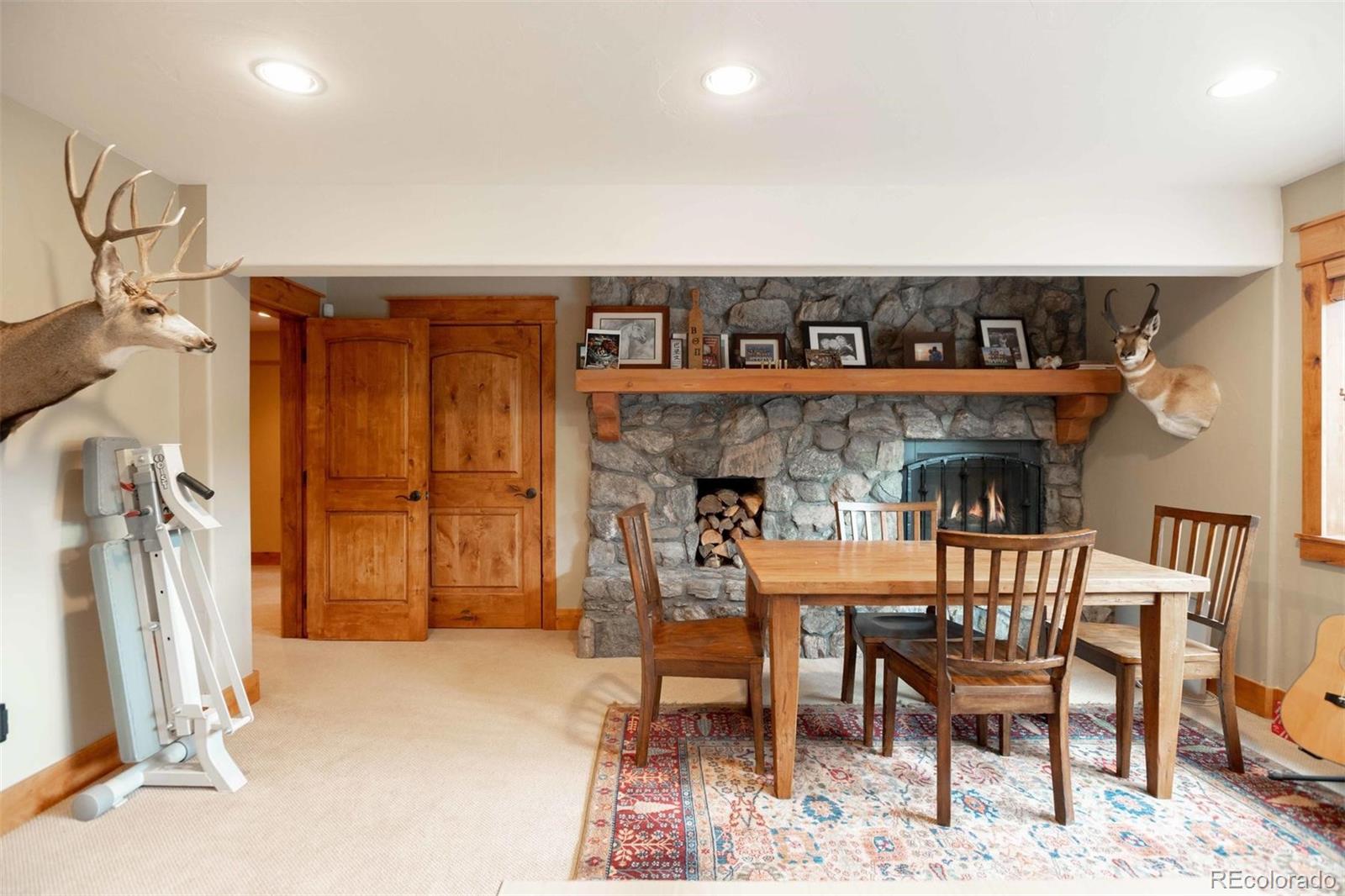 33231 Meadow Mountain Road Evergreen, CO 80439 - Photo 30 of 40 a view of a chairs and table in a room