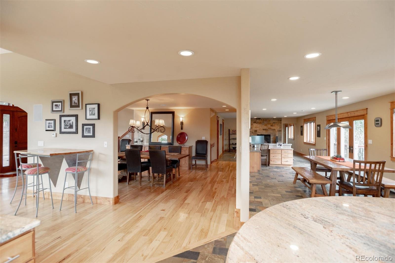 33231 Meadow Mountain Road Evergreen, CO 80439 - Photo 8 of 40 a lobby with furniture and wooden floor