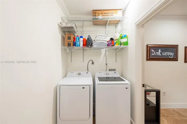 a utility room with dryer and washer
