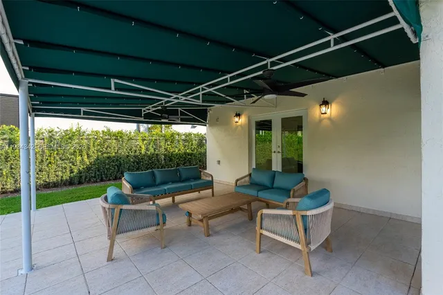 a outdoor living space with furniture and a potted plant