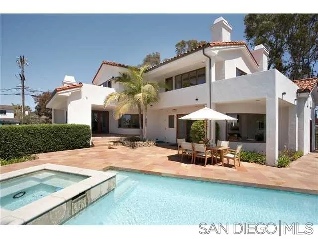 980 Crest Road Del Mar, CA 92014 - Photo 1 of 13 a view of a patio with chairs and tables on the patio
