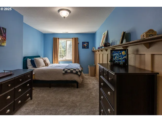 a bedroom with a bed and furniture