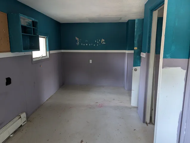 a kitchen with granite countertop a sink stainless steel appliances and cabinets
