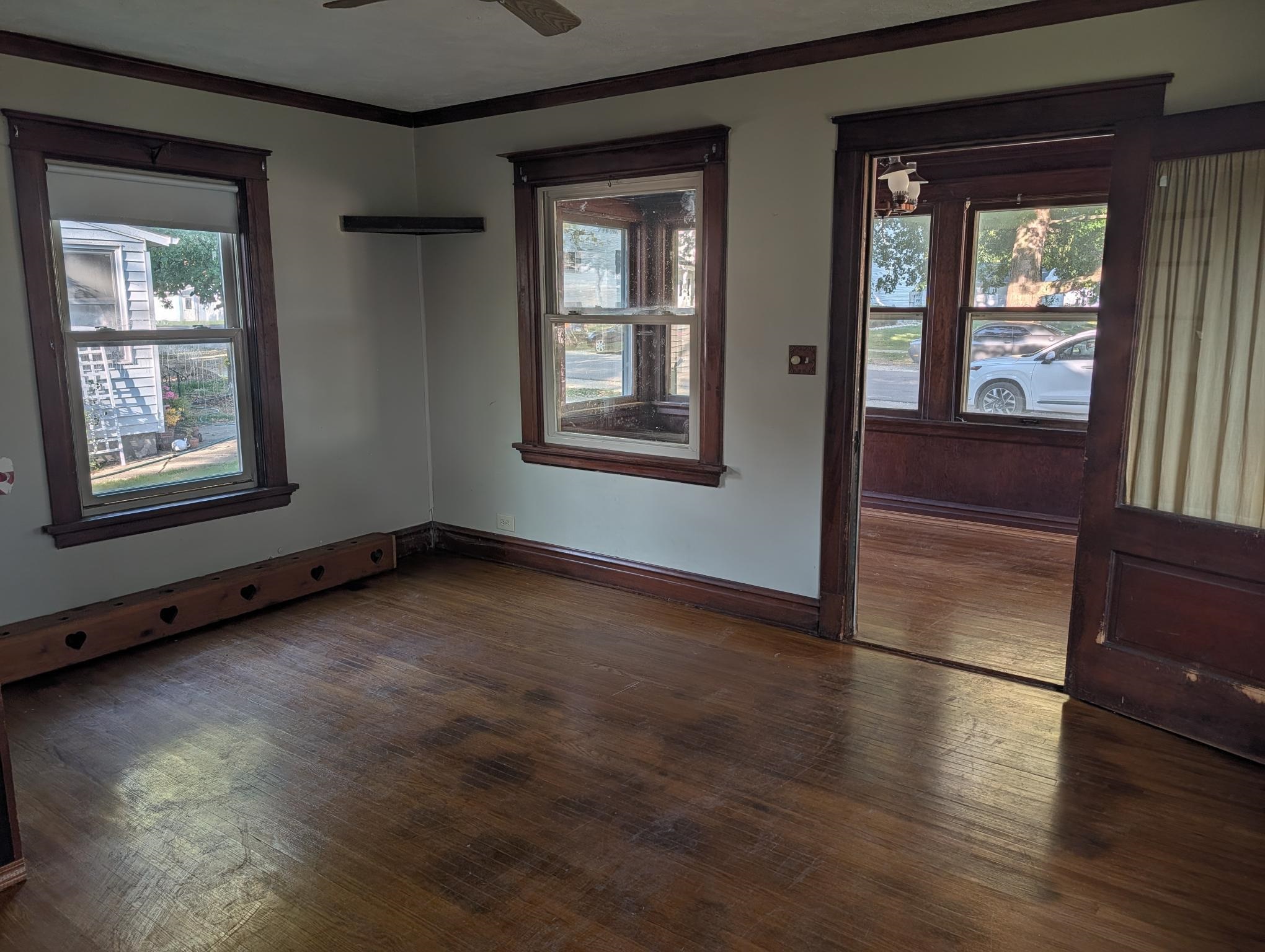 135 North Birch Street Waterman, IL 60556 - Photo 2 of 17 an empty room with wooden floor and windows
