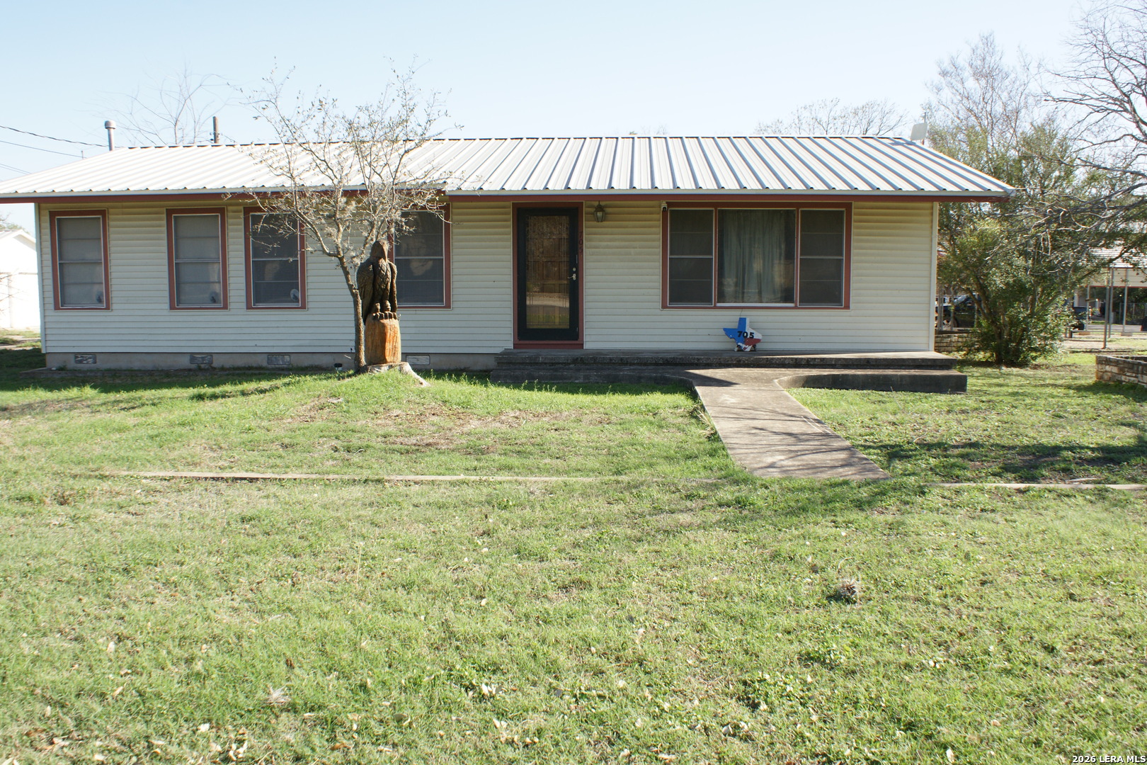 705 Altgelt Street Comfort, TX 78013 - Photo 1 of 14 a backyard of a house with table and chairs