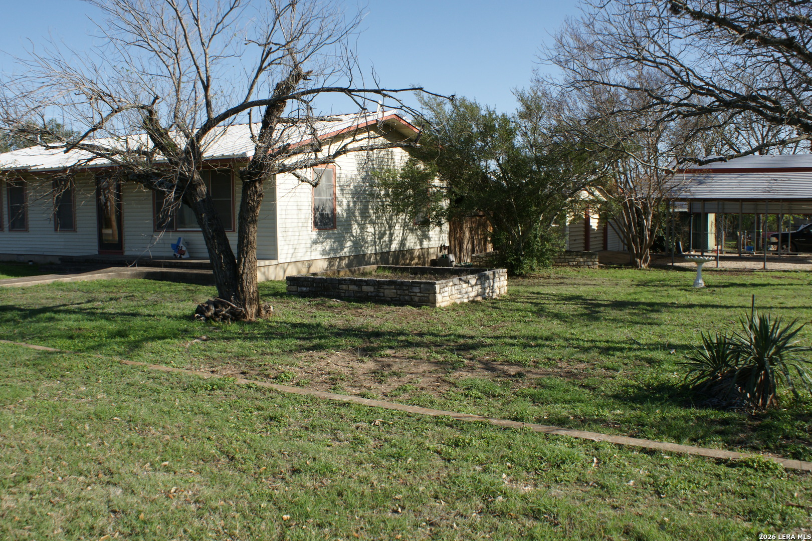 705 Altgelt Street Comfort, TX 78013 - Photo 12 of 14 a backyard of a house with lots of green space