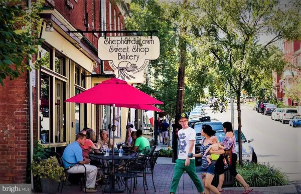 an outdoor space with tables and chairs