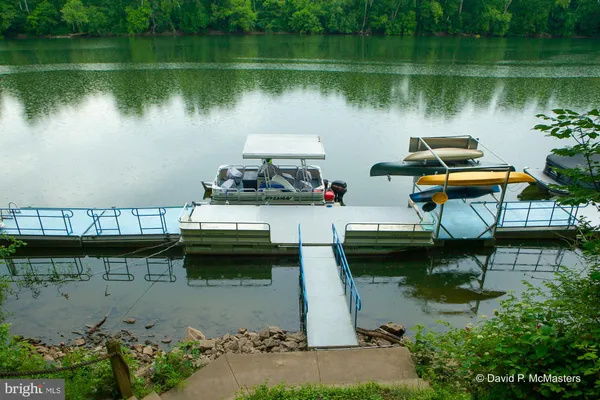 a view of a lake with boats and a bridge