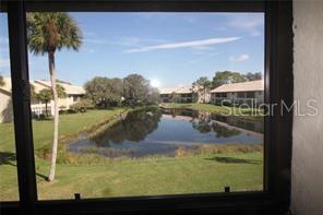 255 Mission Trail South, Unit J Venice, FL 34285 - Photo 13 of 15 a view of swimming pool from a window