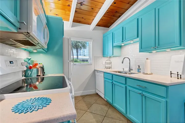 a kitchen with cabinets and a sink