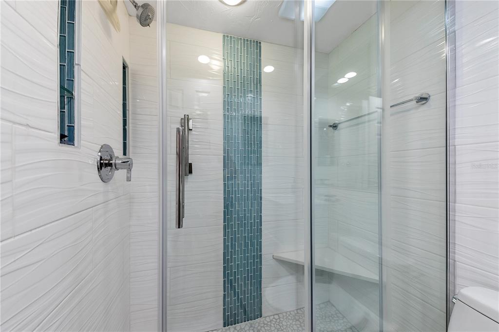 6006 Midnight Pass Road, Unit 16 Sarasota, FL 34242 - Photo 18 of 52 a bathroom with a shower and a sink
