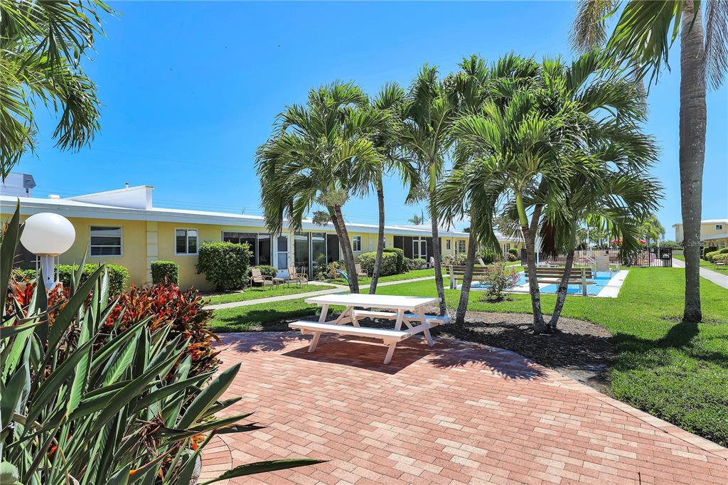 6006 Midnight Pass Road, Unit 16 Sarasota, FL 34242 - Photo 23 of 52 a view of a house with backyard and sitting area