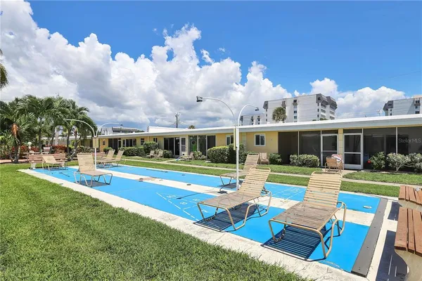 a view of house with outdoor space and swimming pool