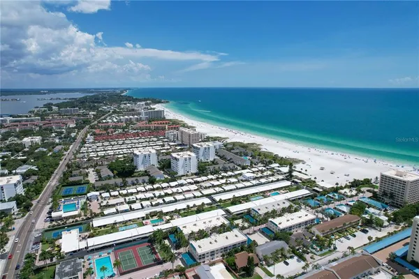 an aerial view of a residential houses with outdoor space
