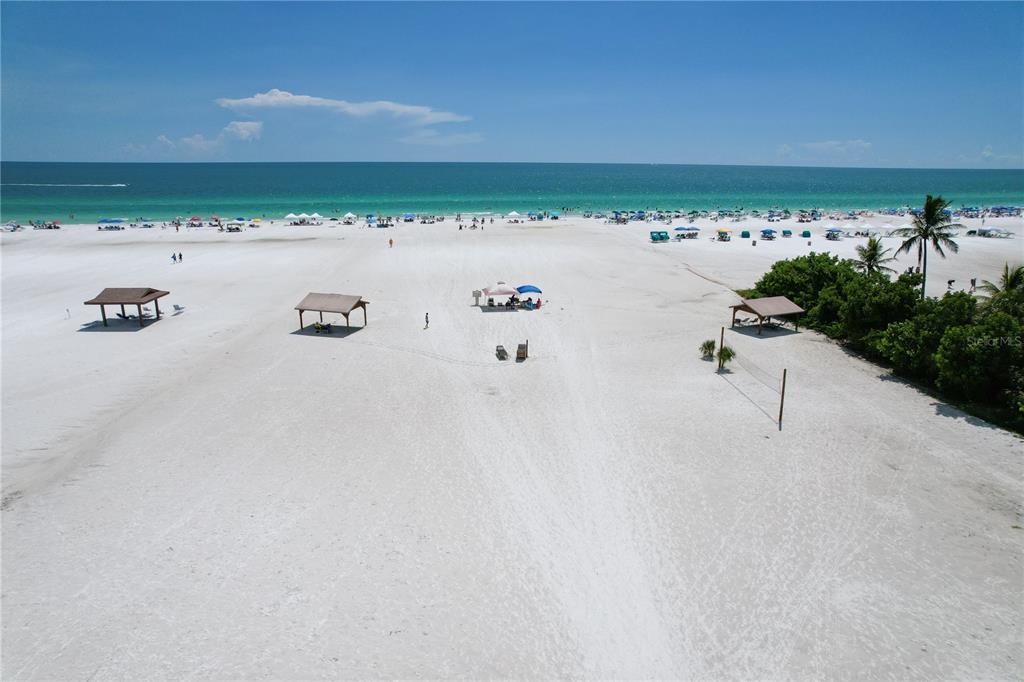 6006 Midnight Pass Road, Unit 16 Sarasota, FL 34242 - Photo 41 of 52 a view of an ocean beach