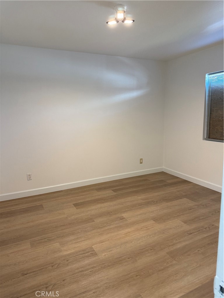 2315 11th Street Riverside, CA 92507 - Photo 12 of 16 a view of an empty room and wooden floor