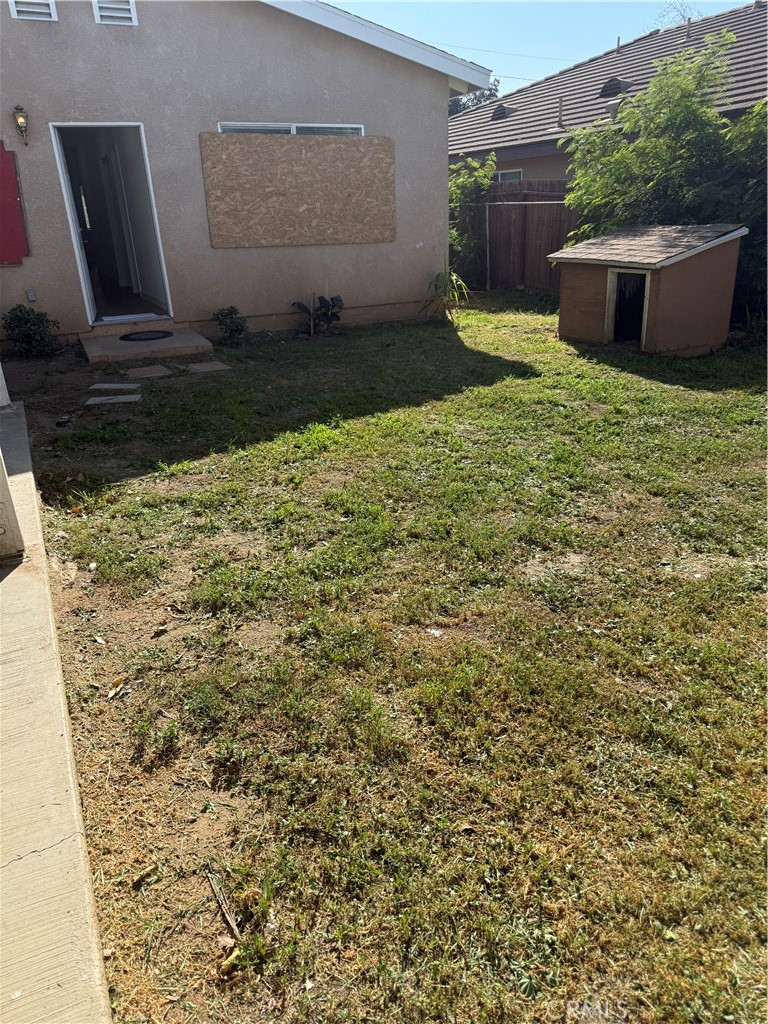 2315 11th Street Riverside, CA 92507 - Photo 15 of 16 a view of a backyard with plants and potted plants