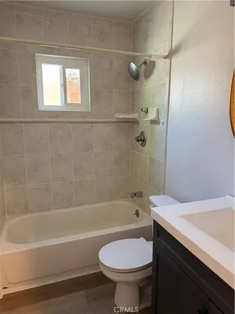 a bathroom with a sink a toilet and a bathtub