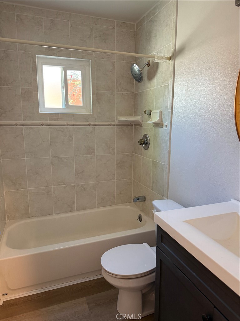 2315 11th Street Riverside, CA 92507 - Photo 8 of 16 a bathroom with a sink a toilet and a bathtub