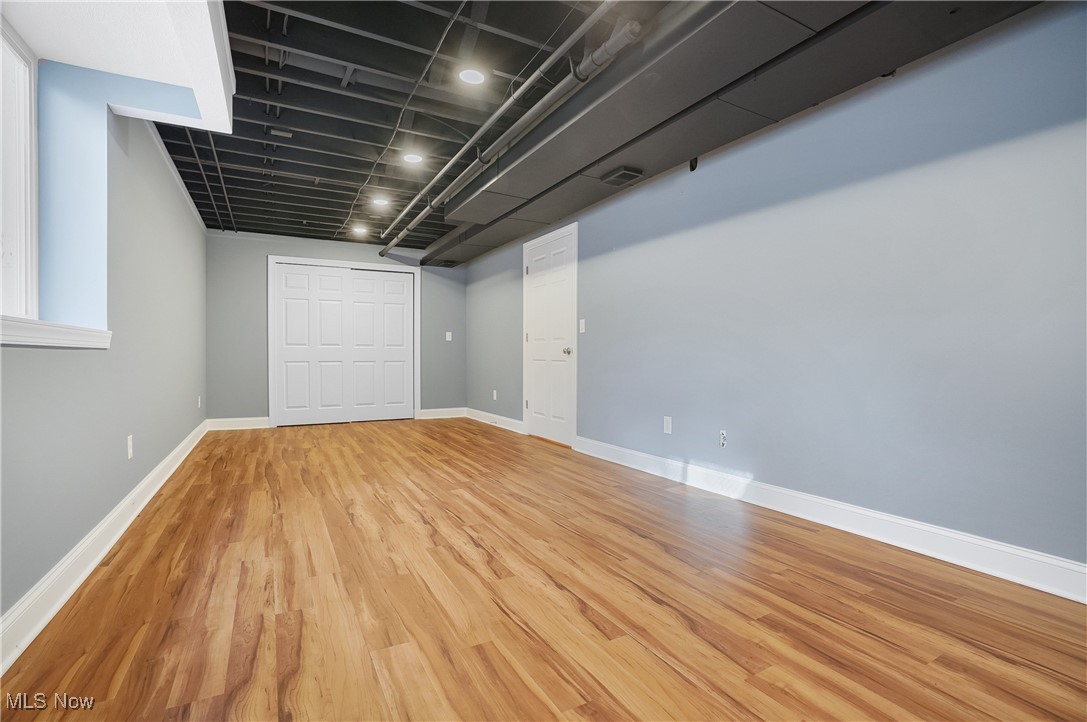 1094 San Raphael Drive Akron, OH 44333 - Photo 40 of 50 Below grade area with light wood-style flooring and baseboards