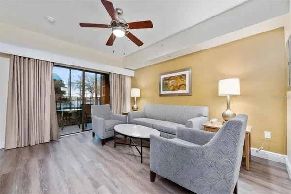 a living room with furniture and a window