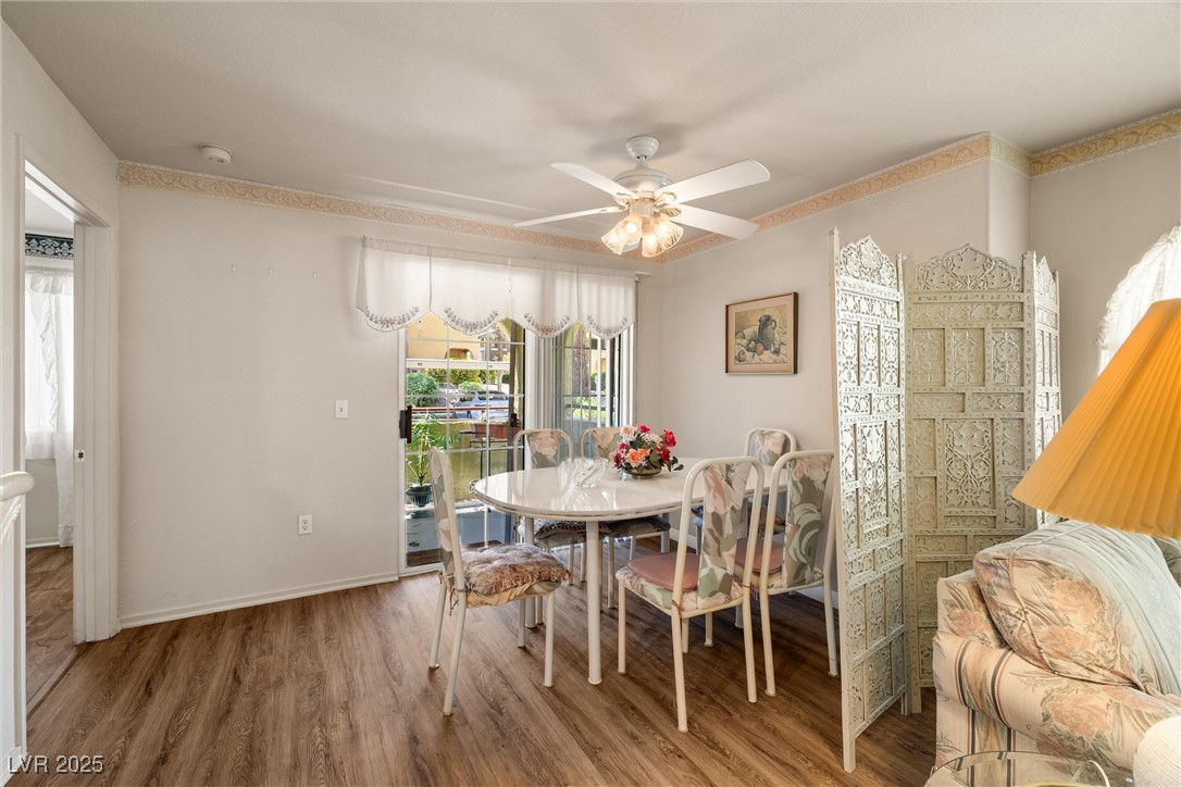 7950 West Flamingo Road, Unit 1024 Las Vegas, NV 89147 - Photo 16 of 30 Dining room with wood finished floors and ceiling