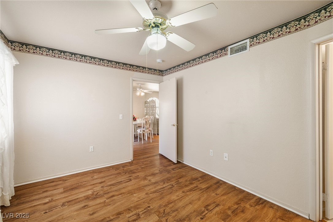 7950 West Flamingo Road, Unit 1024 Las Vegas, NV 89147 - Photo 20 of 30 Unfurnished bedroom with wood finished floors and