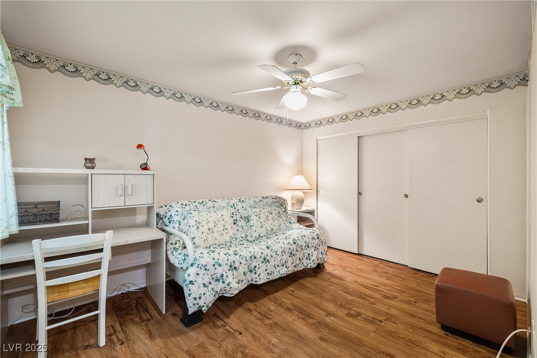 7950 West Flamingo Road, Unit 1024 Las Vegas, NV 89147 - Photo 24 of 30 Bedroom featuring wood finished floors, a closet,
