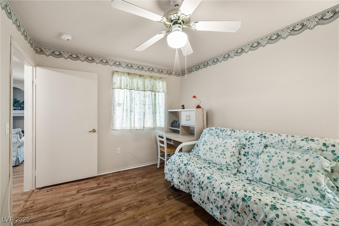 7950 West Flamingo Road, Unit 1024 Las Vegas, NV 89147 - Photo 25 of 30 Bedroom with wood finished floors and a ceiling fa